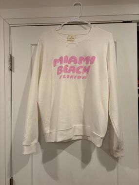 Ocean Drive Cream Crewneck Sweatshirt with Pink 'Miami Beach' Graphic